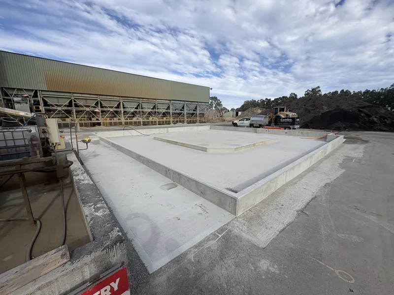 Completed concrete hardstand with drainage pits at the Downer plant