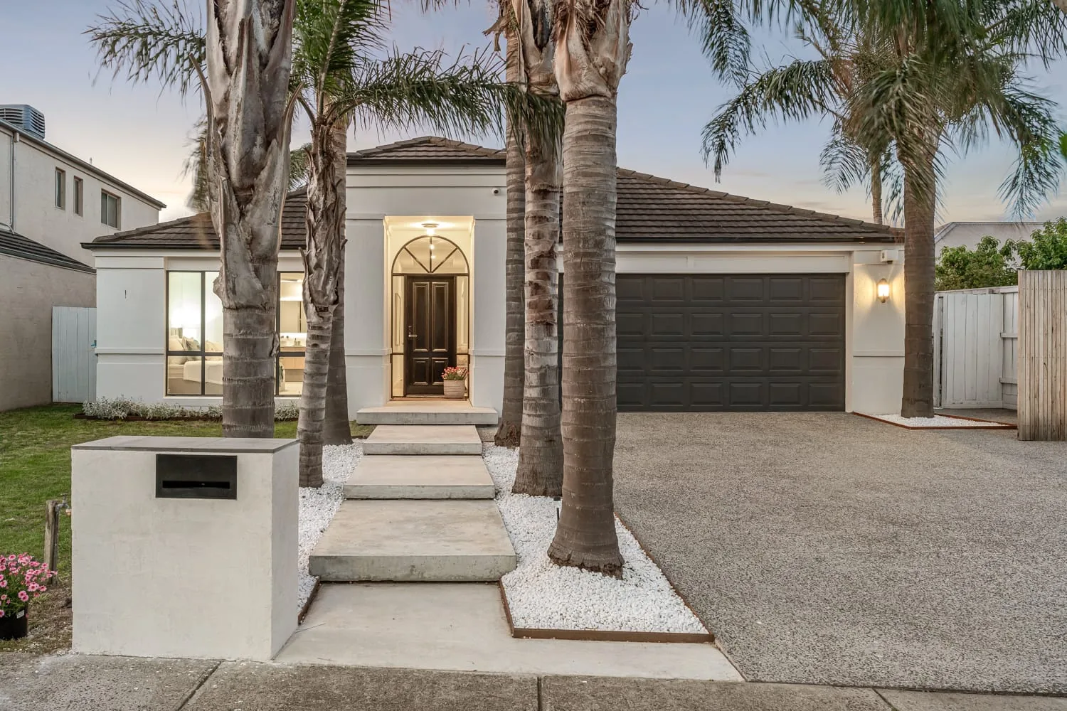 Completed Combo Constructions home, front elevation with a portico entry
